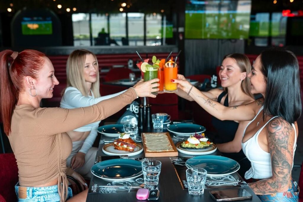 friends enjoying meal at charcoal garden