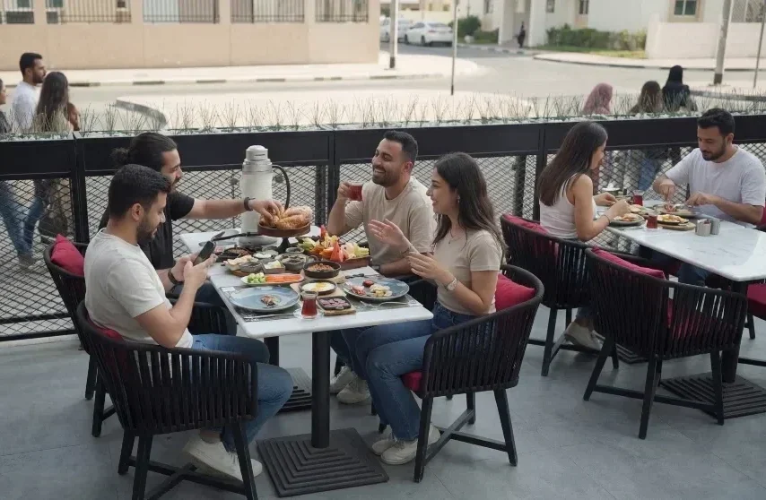 breakfast vs brunch families enjoying both on separate tables at Charcoal Garden