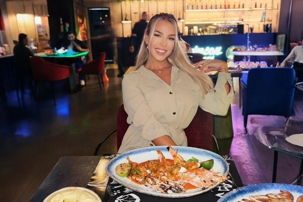 lady presenting business lunch dish