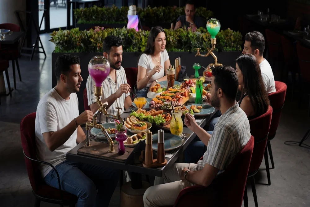 people enjoying dinner at charcoal garden